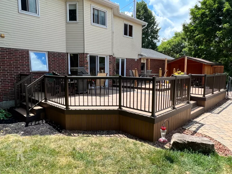 Clubhouse deck with aluminum railing with gate insert for access.