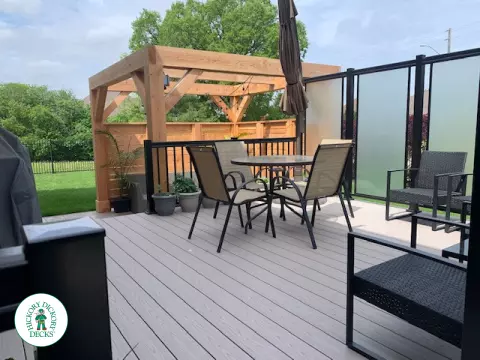 Slate grey Azek deck with large privacy screens, a pergola and aluminum rails, Kitchener, Ontario