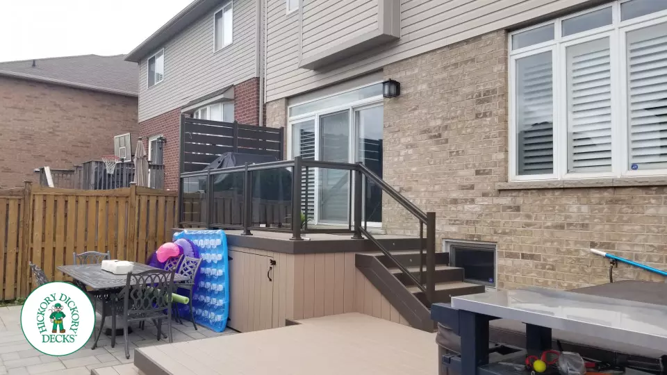 Clubhouse hot tub deck with glass railings in Hamilton Mountain