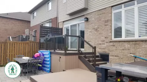 Clubhouse hot tub deck with glass railings in Hamilton Mountain