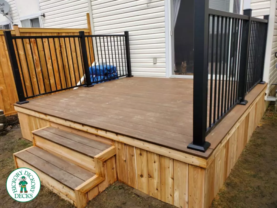 Small brown fiberon deck with black aluminum railing.