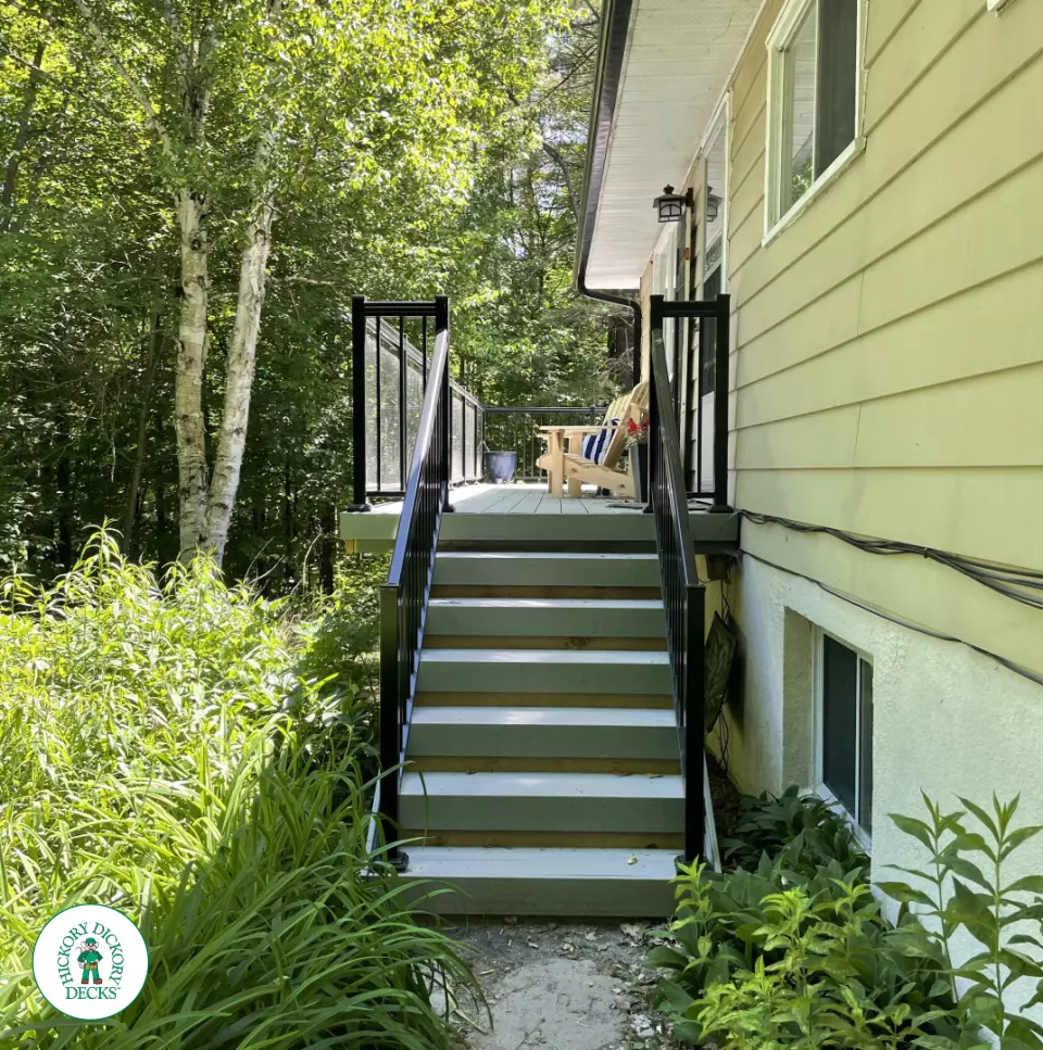 Timbertech elevated deck with glass railing and stairs in Gravenhurst Timbertech elevated deck with glass railing and stairs in Gravenhurst