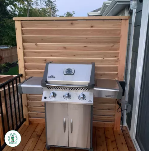 Small Poolside Cedar Deck with Stairs with Lights in Ottawa