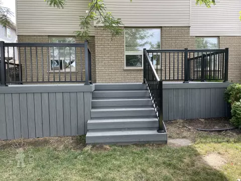 Small porch and deck built in dark grey clubhouse