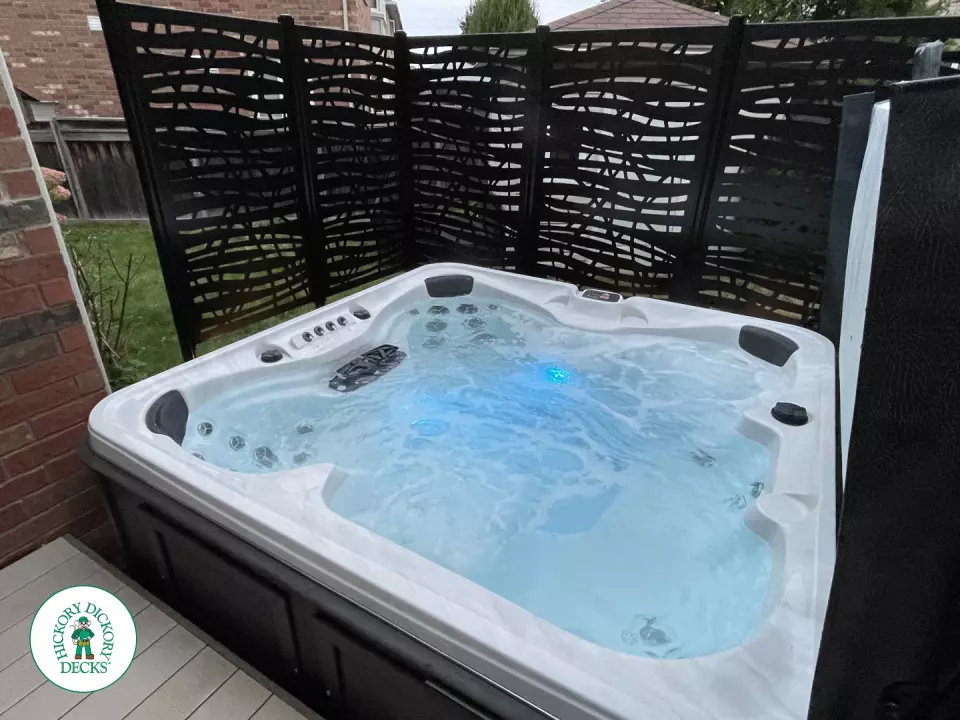 Clubhouse hot tub deck with built in lights pergola and privacy screens