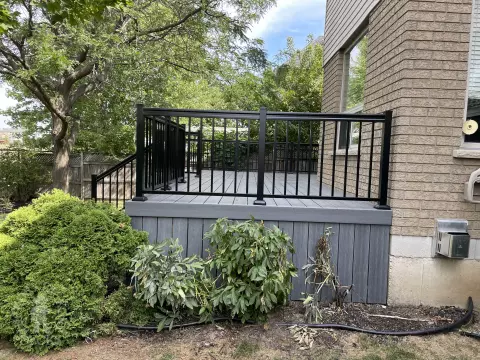 Small porch and deck built in dark grey clubhouse