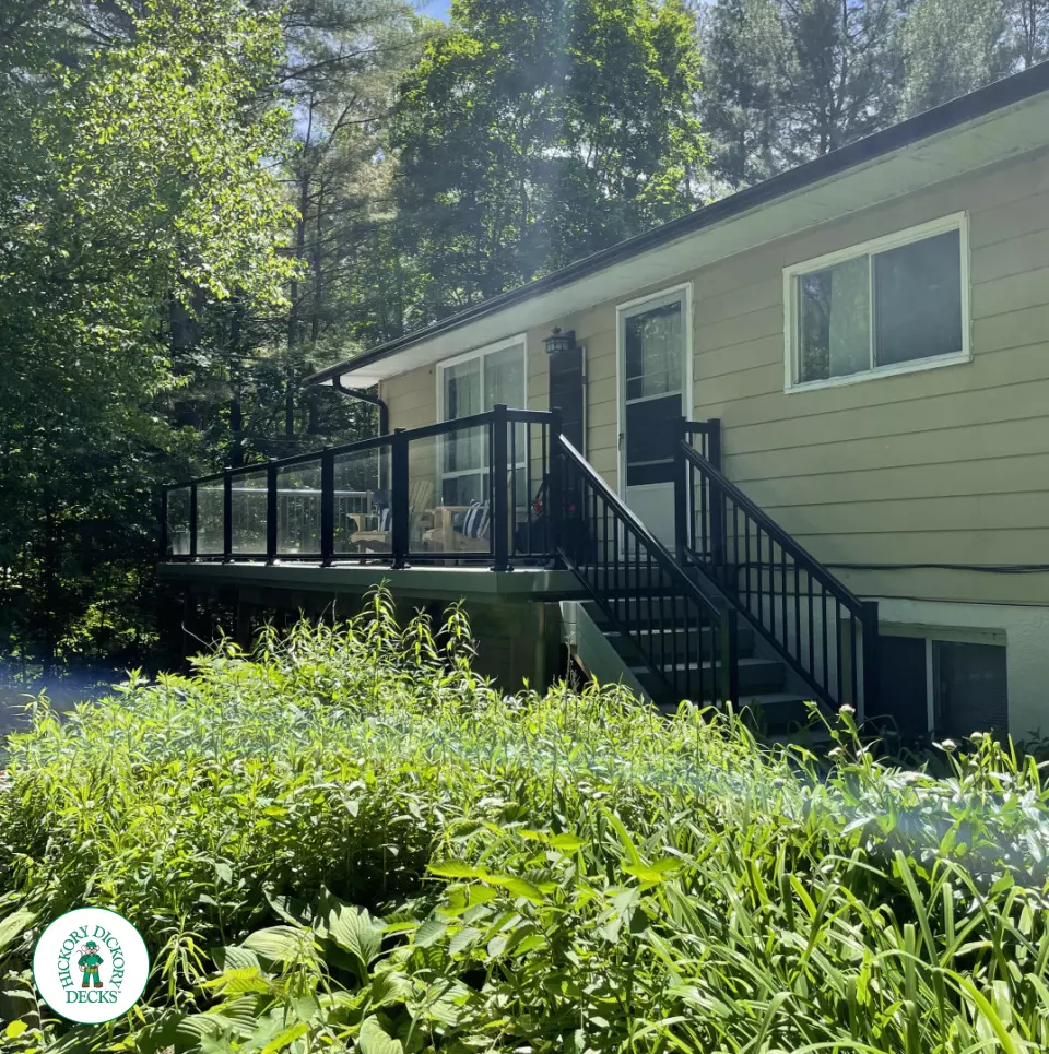 Timbertech elevated deck with glass railing and stairs in Gravenhurst Timbertech elevated deck with glass railing and stairs in Gravenhurst
