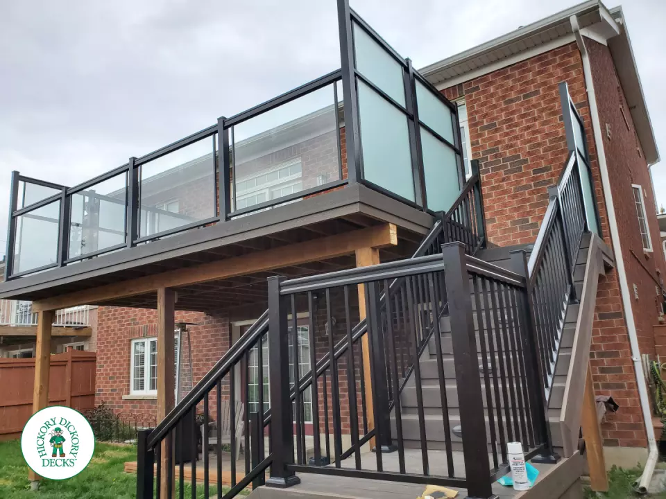 Clubhouse high deck with glass railings and privacy screens in Oshawa
