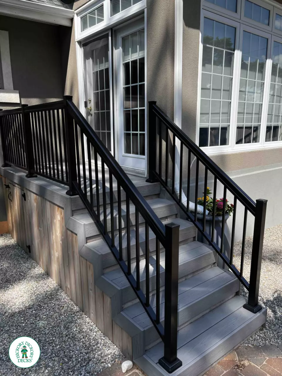 Small grey fiberon deck with black aluminum railing