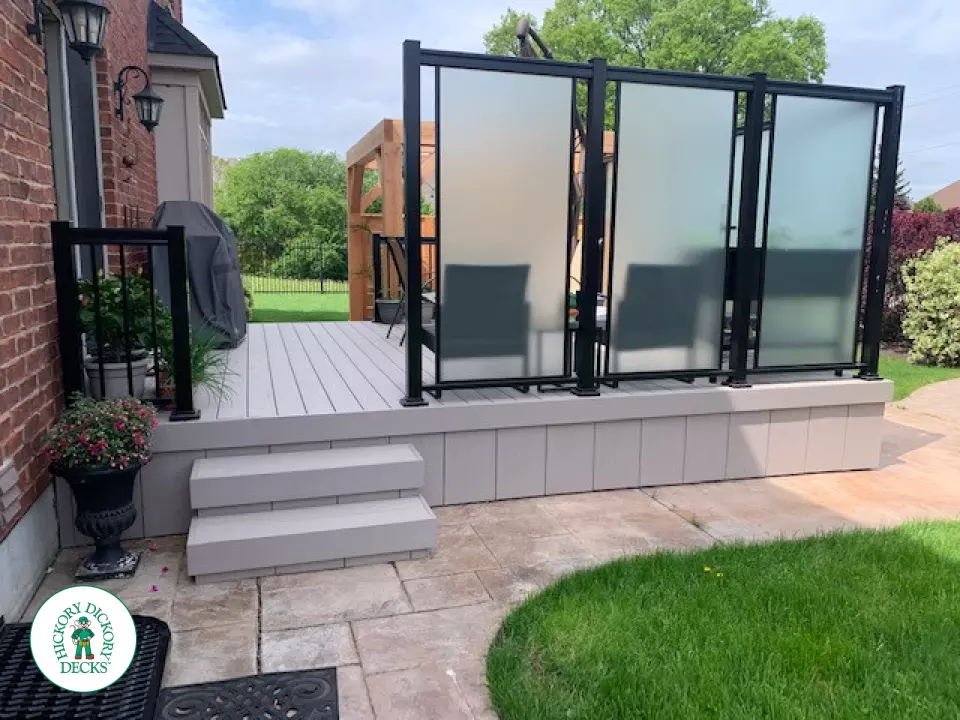 Slate grey Azek deck with large privacy screens, a pergola and aluminum rails, Kitchener, Ontario