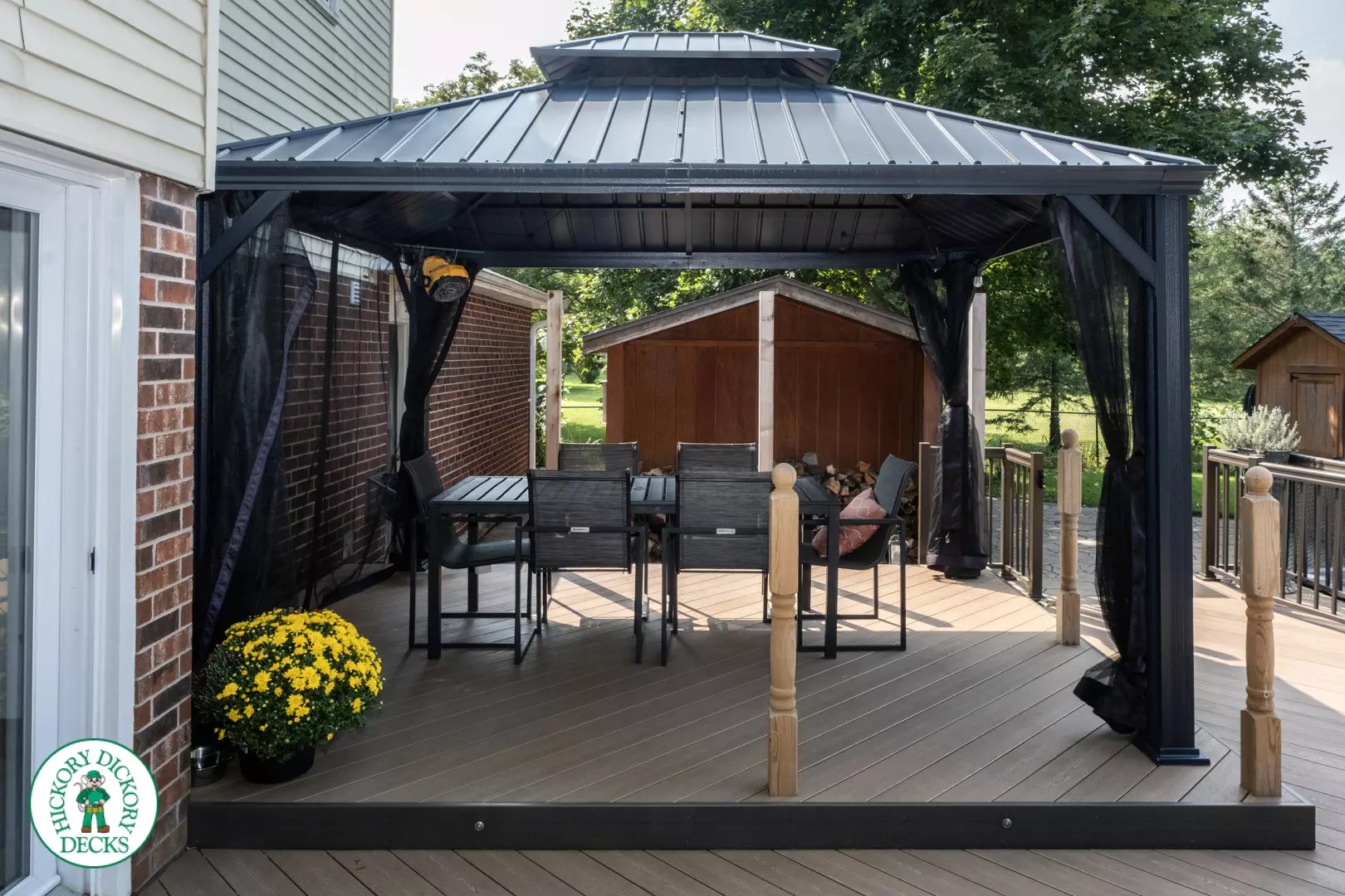 Clubhouse deck with aluminum railing with gate insert for access.