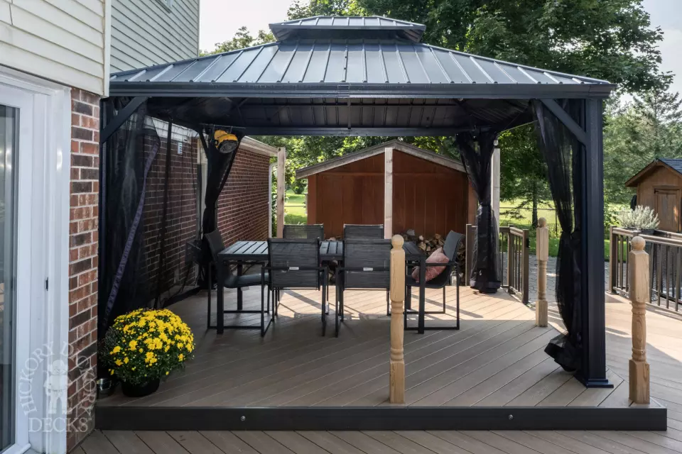 Clubhouse deck with aluminum railing with gate insert for access.