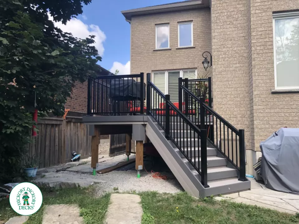 Azek deck with aluminum railing and lights in stairs in Innisfil