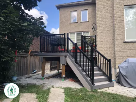 Azek deck with aluminum railing and lights in stairs in Innisfil