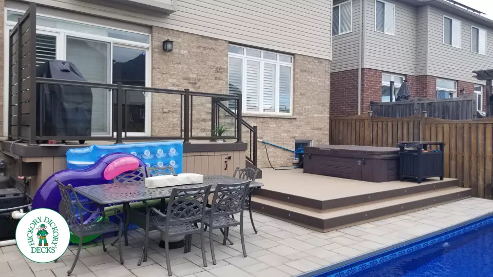 Clubhouse hot tub deck with glass railings in Hamilton Mountain