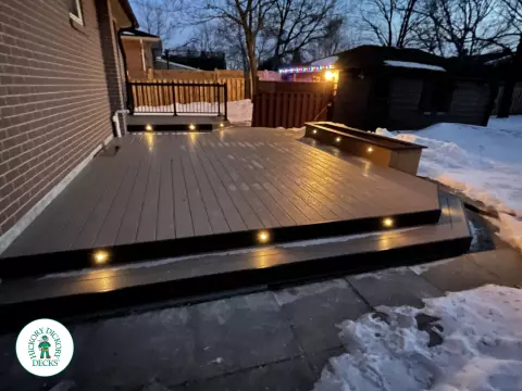 Brown clubhouse deck with lighting in steps.
