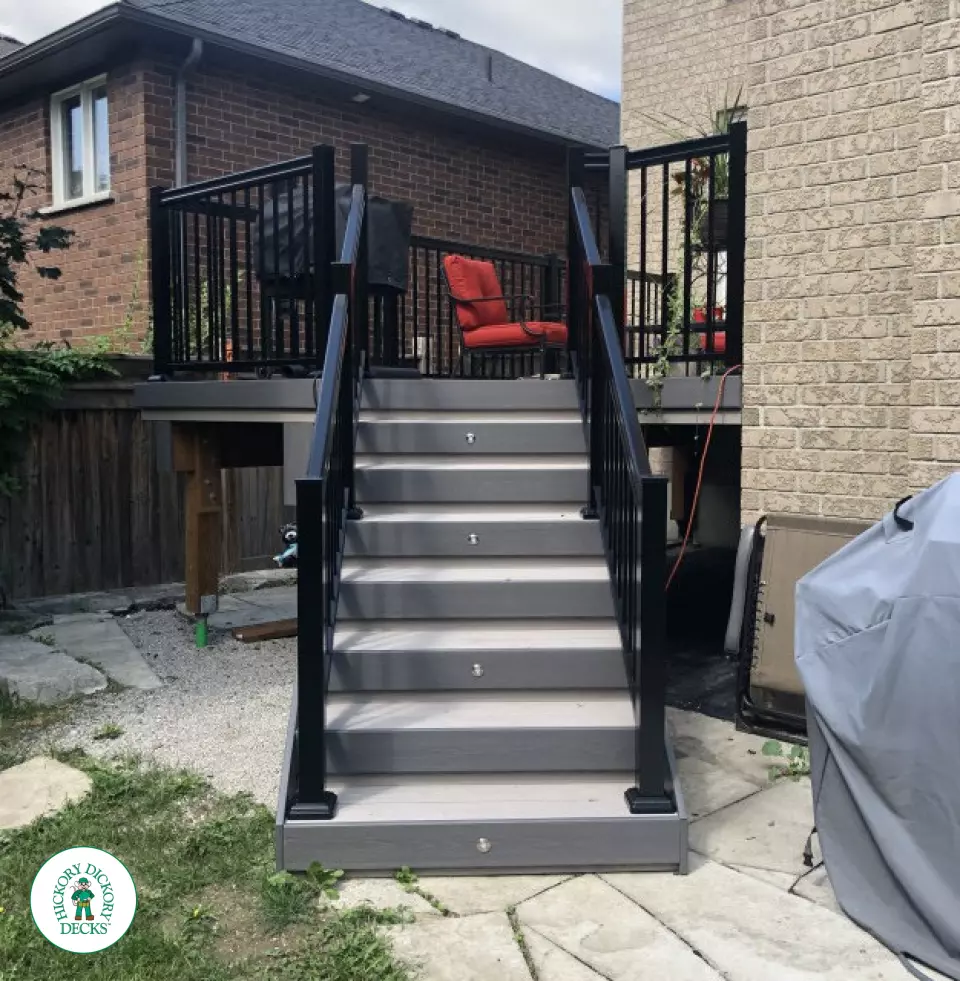 Azek deck with aluminum railing and lights in stairs in Innisfil