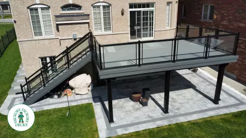 Trex high deck with glass railings in Brampton
