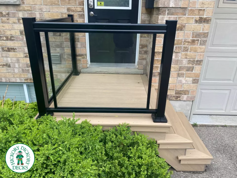 Small composite porch in grey/beige color with three steps.