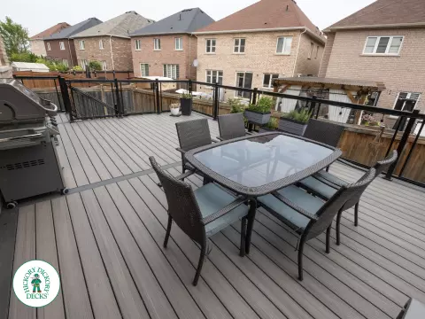 Elevated trex deck with glass railings and stairs in Brampton Elevated trex deck with glass railings and stairs in Brampton