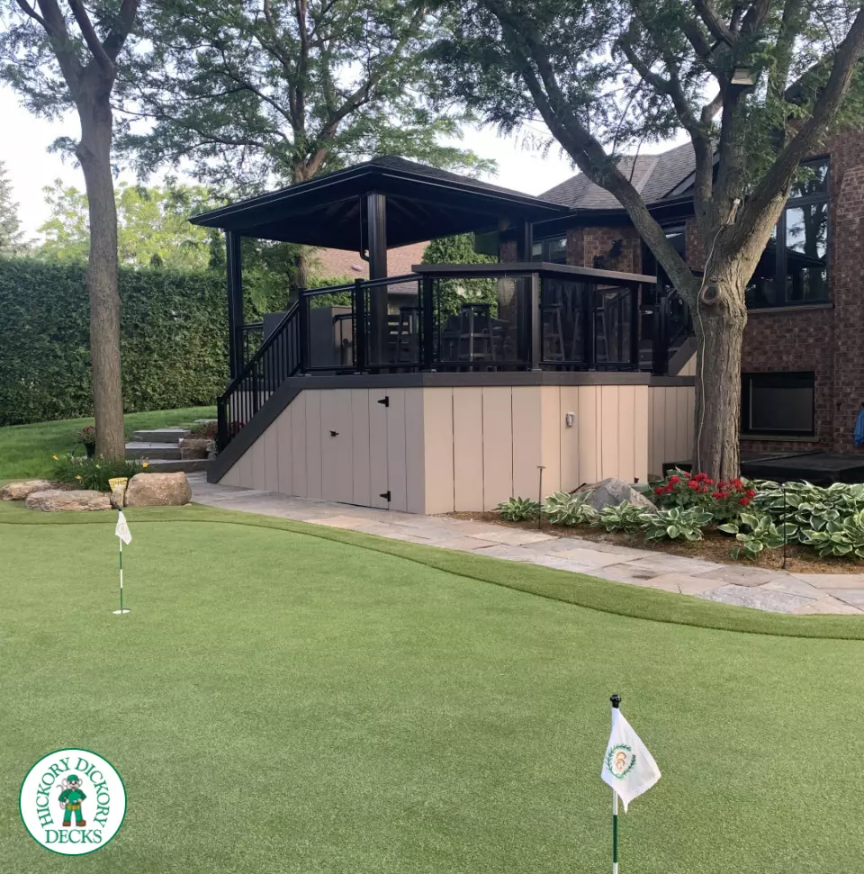 Clubhouse deck in cobblestone with a pavilion, glass railings, lights and a bar seating area, Flamborough, Ontario