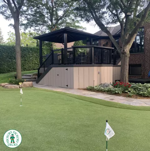 Clubhouse deck in cobblestone with a pavilion, glass railings, lights and a bar seating area, Flamborough, Ontario