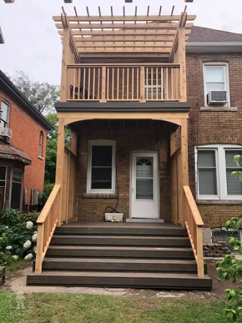 Trex high deck with cedar rail and pergola in Hamilton