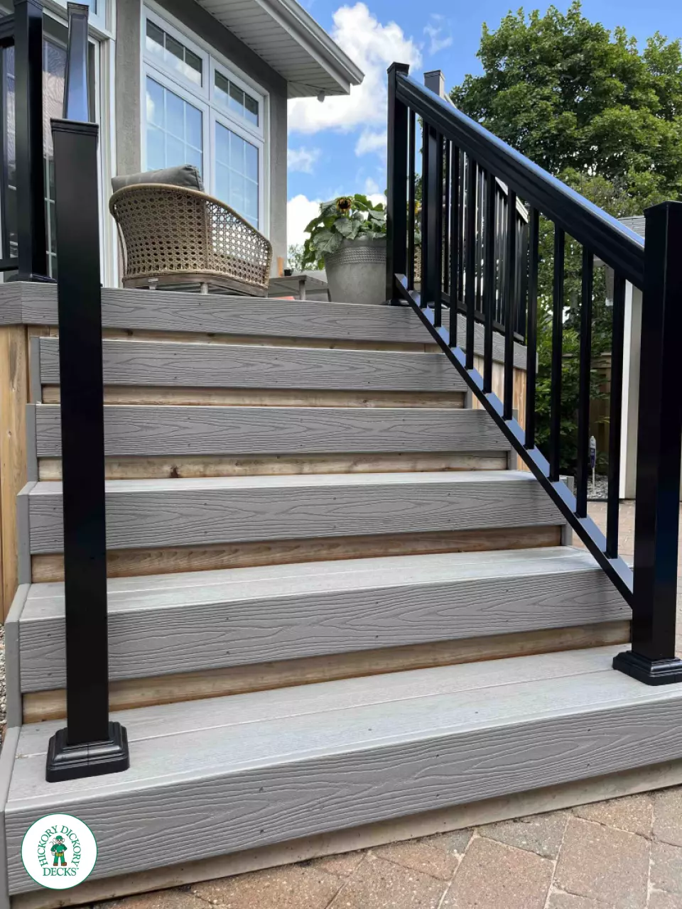Small grey fiberon deck with black aluminum railing