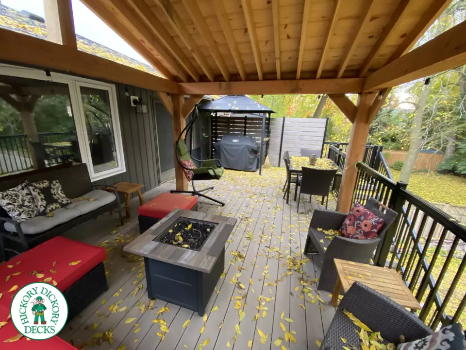 Mid-high deck brown TruNorth deck with lighting in steps and black aluminum railing all around.