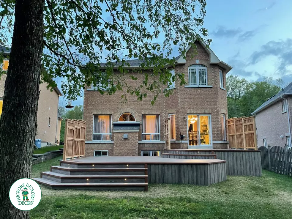 Zuri deck with floor pattern, built in ights and privacy screens in Richmond Hill