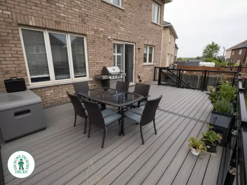 Elevated trex deck with glass railings and stairs in Brampton Elevated trex deck with glass railings and stairs in Brampton