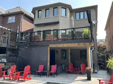 Clubhouse high deck with glass rail and spiral staircase in Newmarket
