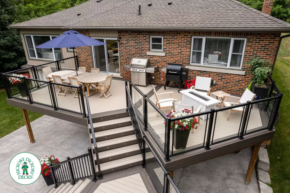 Clubhouse multi level deck with glass railings and lights in Cambridge