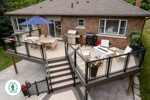 Clubhouse multi level deck with glass railings and lights in Cambridge