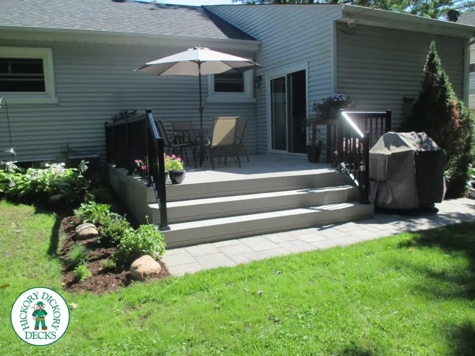 Small walk out clubhouse deck in grey color.