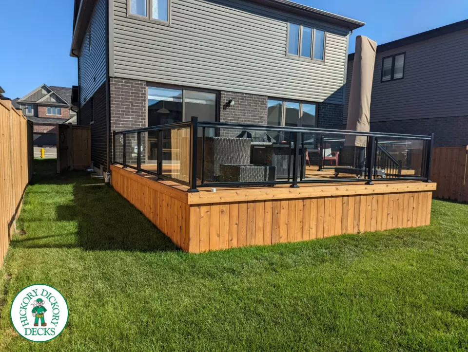 Large cedar deck with stairs, aluminum railing