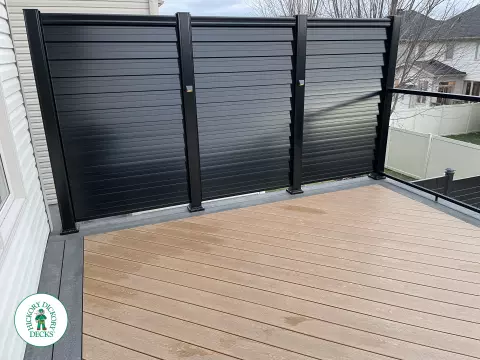Clubhouse high deck with privacy and glass railings in Ottawa
