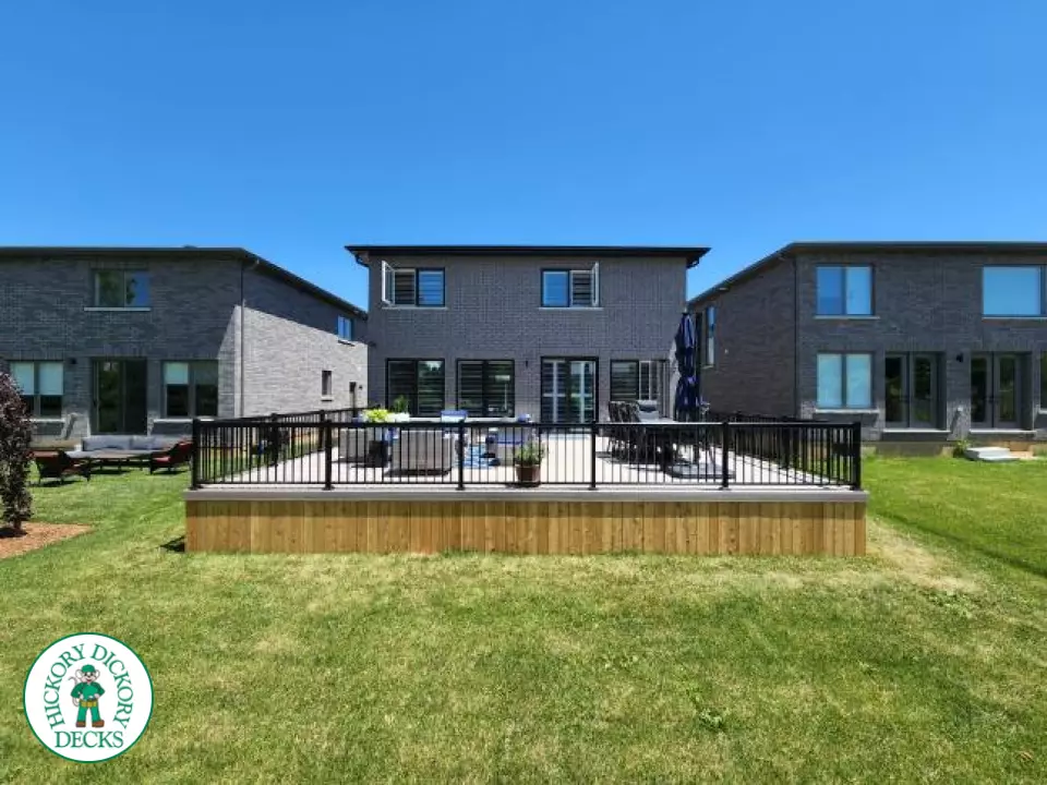 Large grey fiberon walk out deck with black aluminum railings