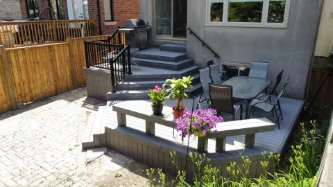 Small multilevel grey deck with lights in steps
