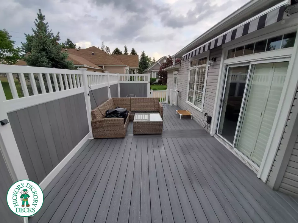 Private grey walk out deck with grey privacy screen all around