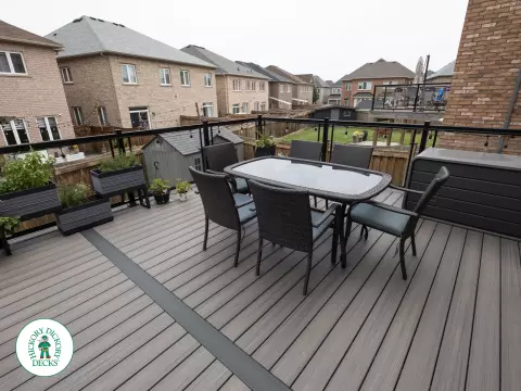Elevated trex deck with glass railings and stairs in Brampton Elevated trex deck with glass railings and stairs in Brampton