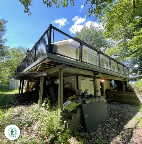 Timbertech elevated deck with glass railing and stairs in Gravenhurst Timbertech elevated deck with glass railing and stairs in Gravenhurst