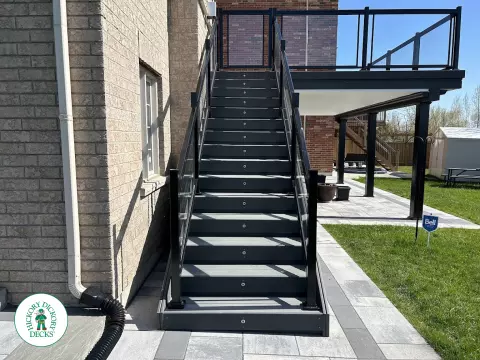 Trex high deck with glass railings in Brampton