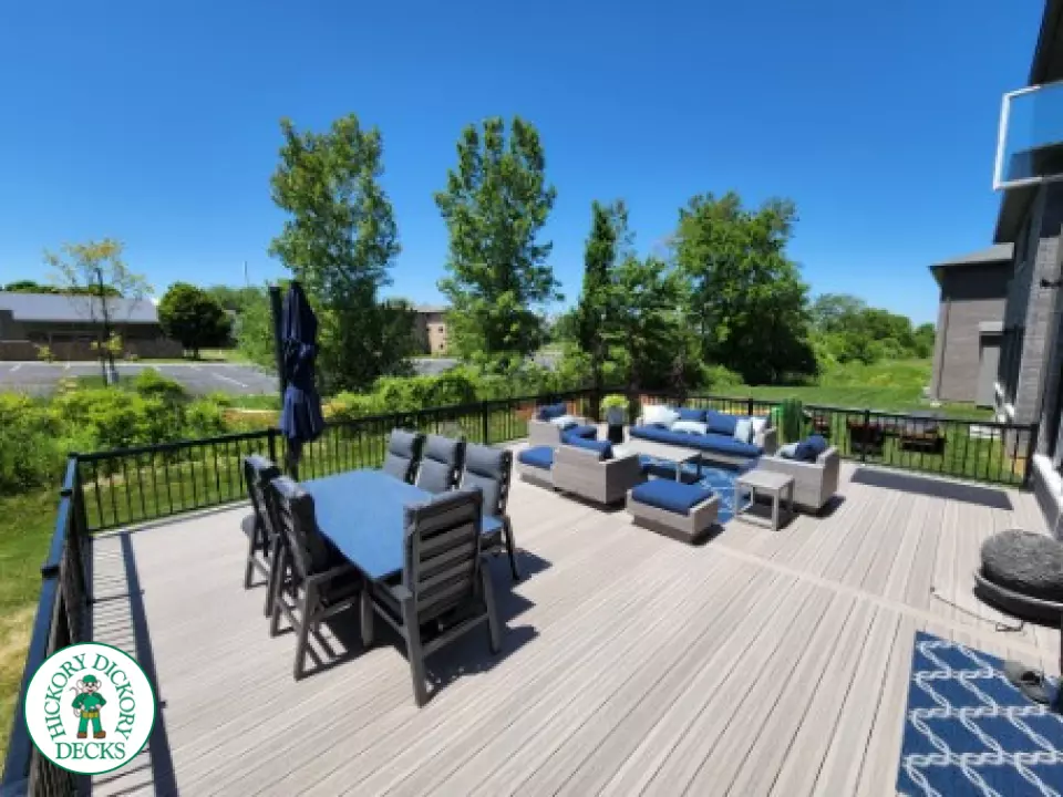 Large grey fiberon walk out deck with black aluminum railings