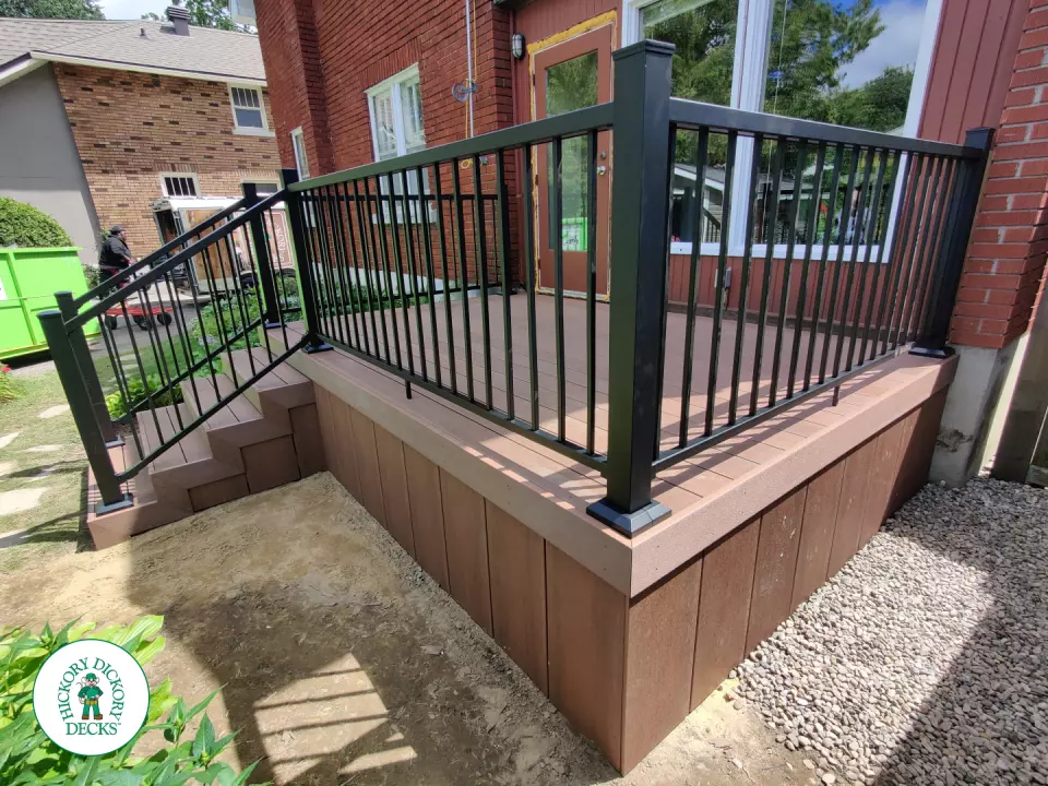 Small brown fiberon deck with black aluminum railing.