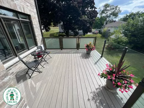 High grey composite deck with glass style railings.