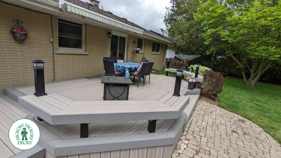 Low to ground grey deck with custom benches