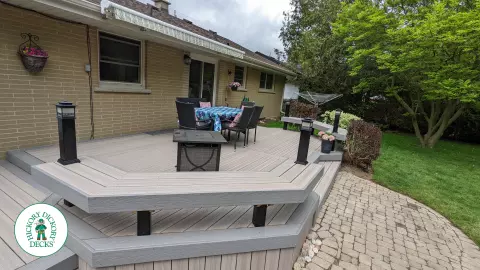 Low to ground grey deck with custom benches