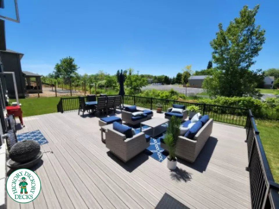 Large grey fiberon walk out deck with black aluminum railings