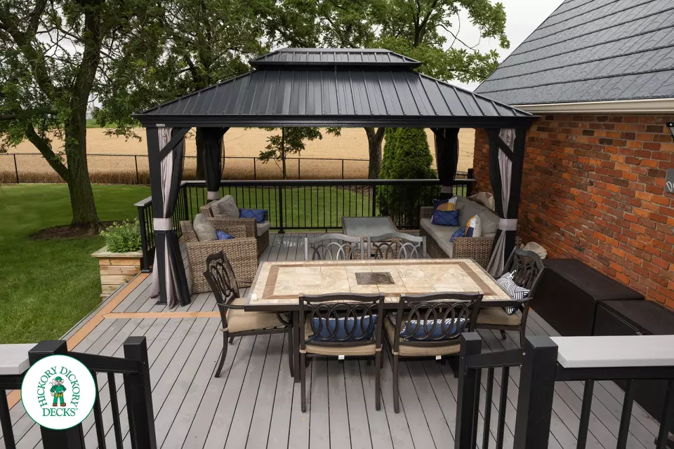 Grey TruNorth deck with brown borders and aluminum railing.